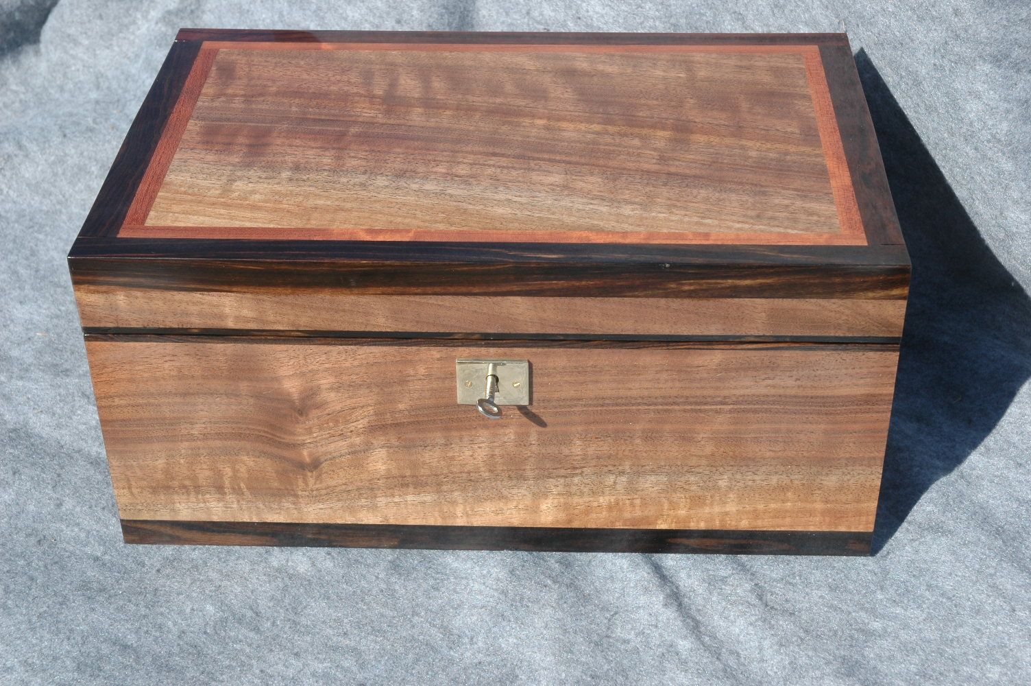 high quality keepsake box handcrafted with lock top front side Figured Walnut W/Ebony trim